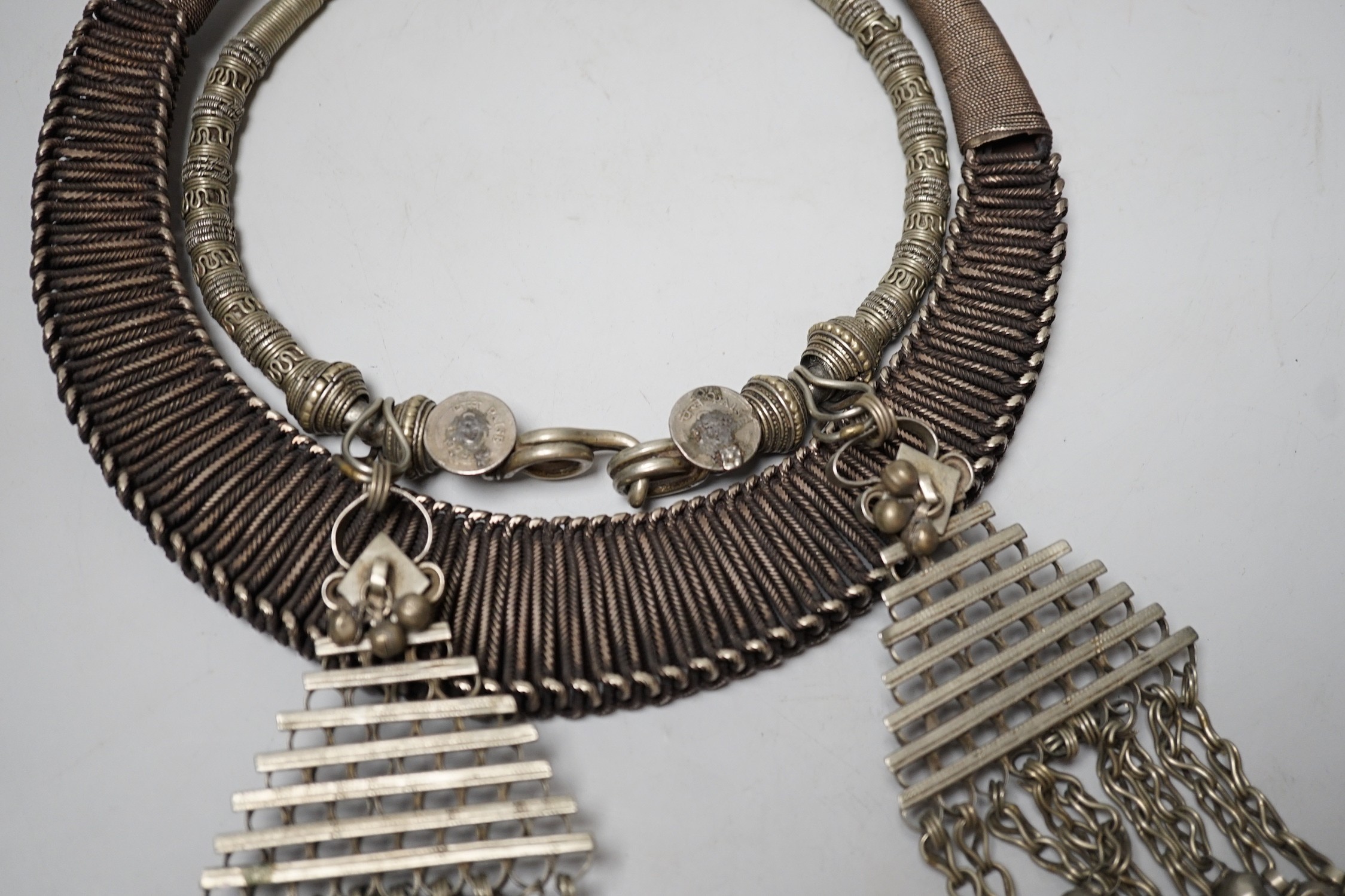 A Chinese Miao Hmong white metal wirework necklace and an Indian necklace